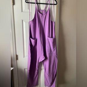 Size medium. Worn a few times. Has a small hole by right arm.